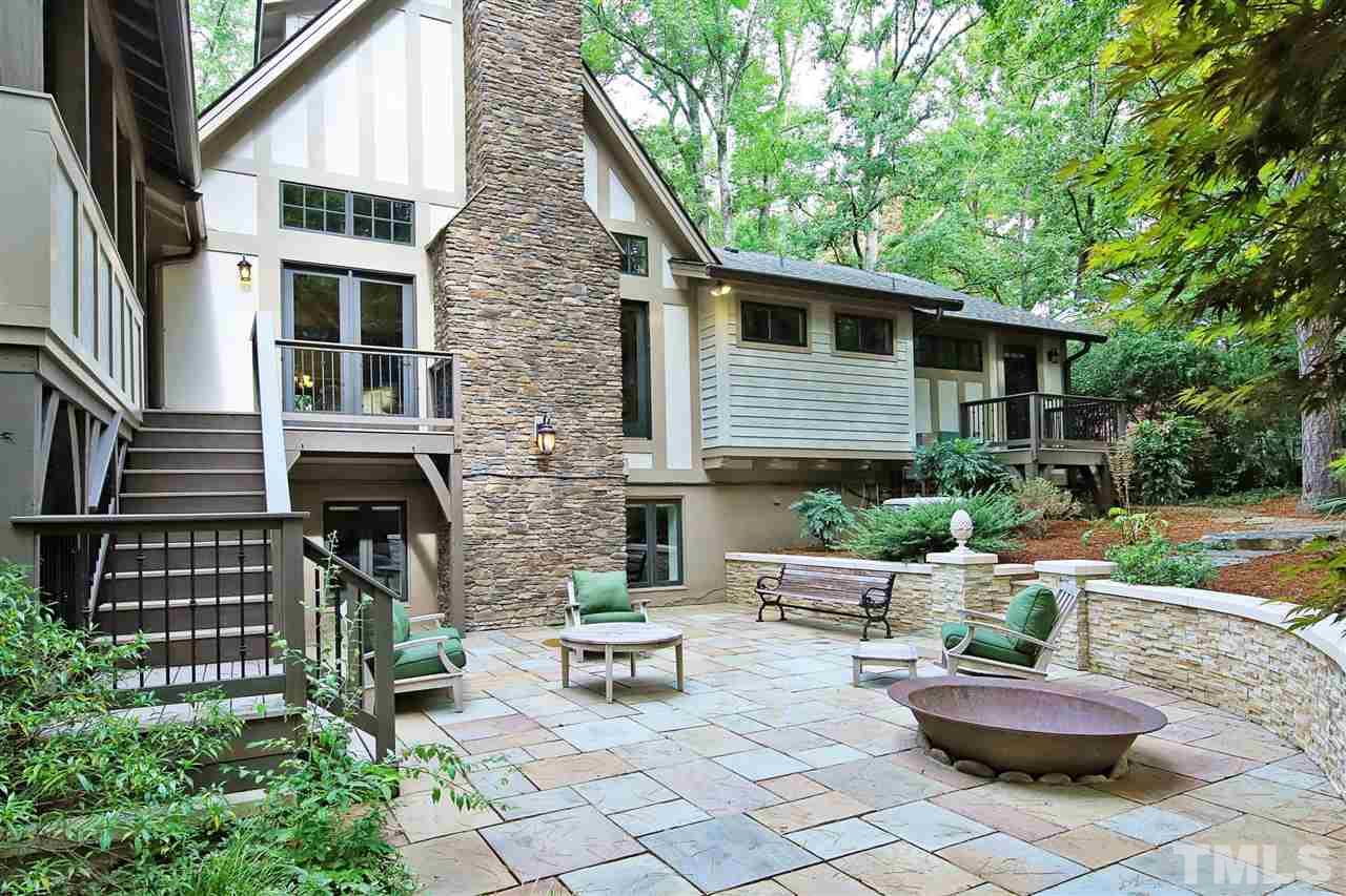 3411 Dover Road Durham, NC 27707 - Photo 22 of 29 A large stone patio in the back yard offers a spot for relaxing. The fire pit promises good times in cooler weather. The fire pit vessel is a former container for boiling sugar cane.