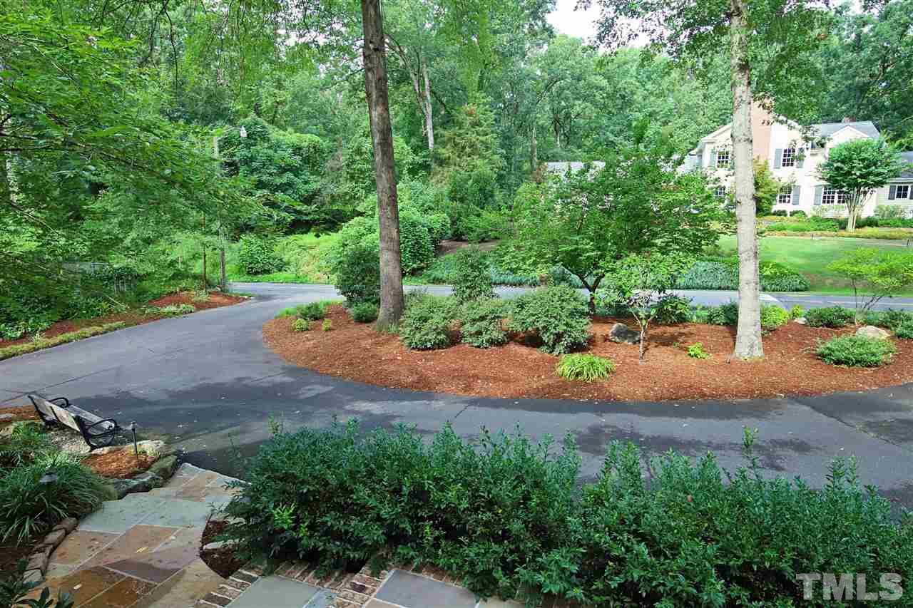 3411 Dover Road Durham, NC 27707 - Photo 25 of 29 The circular drive offers nice off street parking for guests. The plantings and growth in front of the house offer privacy.