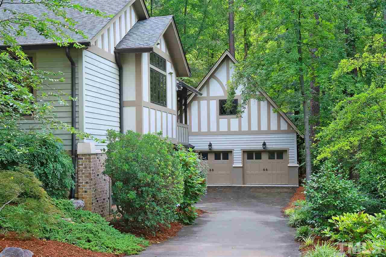3411 Dover Road Durham, NC 27707 - Photo 4 of 29 The detached oversized garage offers two storage areas on the main level and then stairs lead to a workshop area/storage area or perhaps an area to finish in the future.