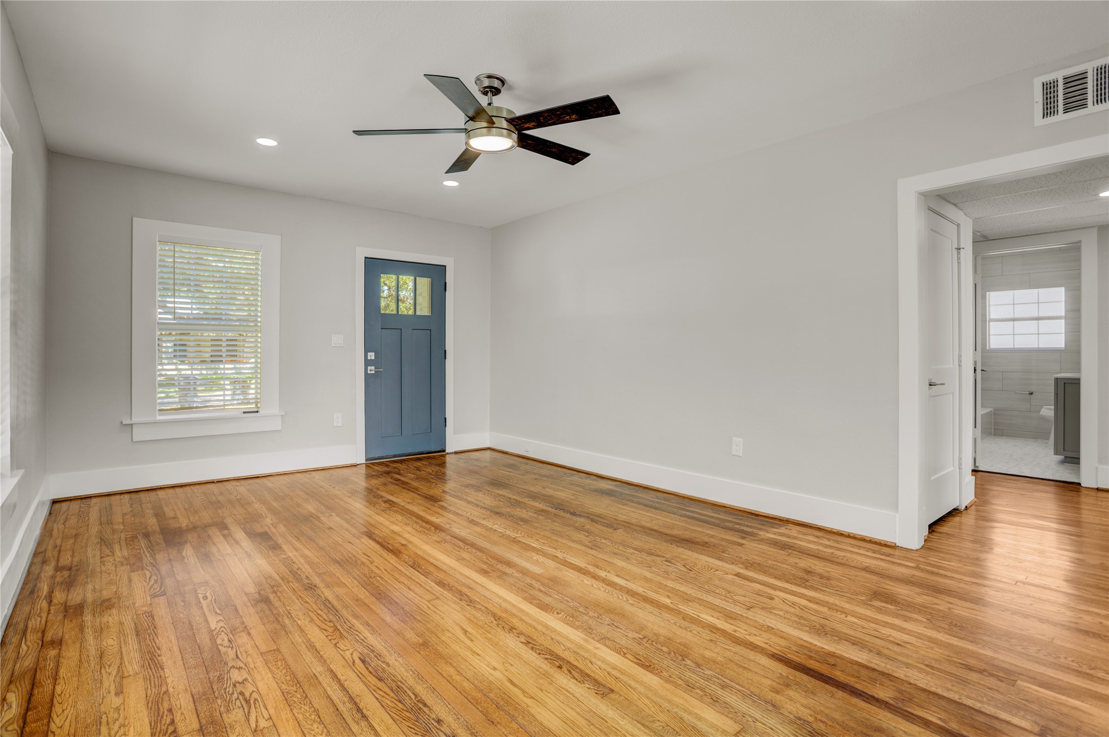 4314 Bell Street, Unit 1 Houston, TX 77023 - Photo 11 of 17 wooden floor in an empty room with a window