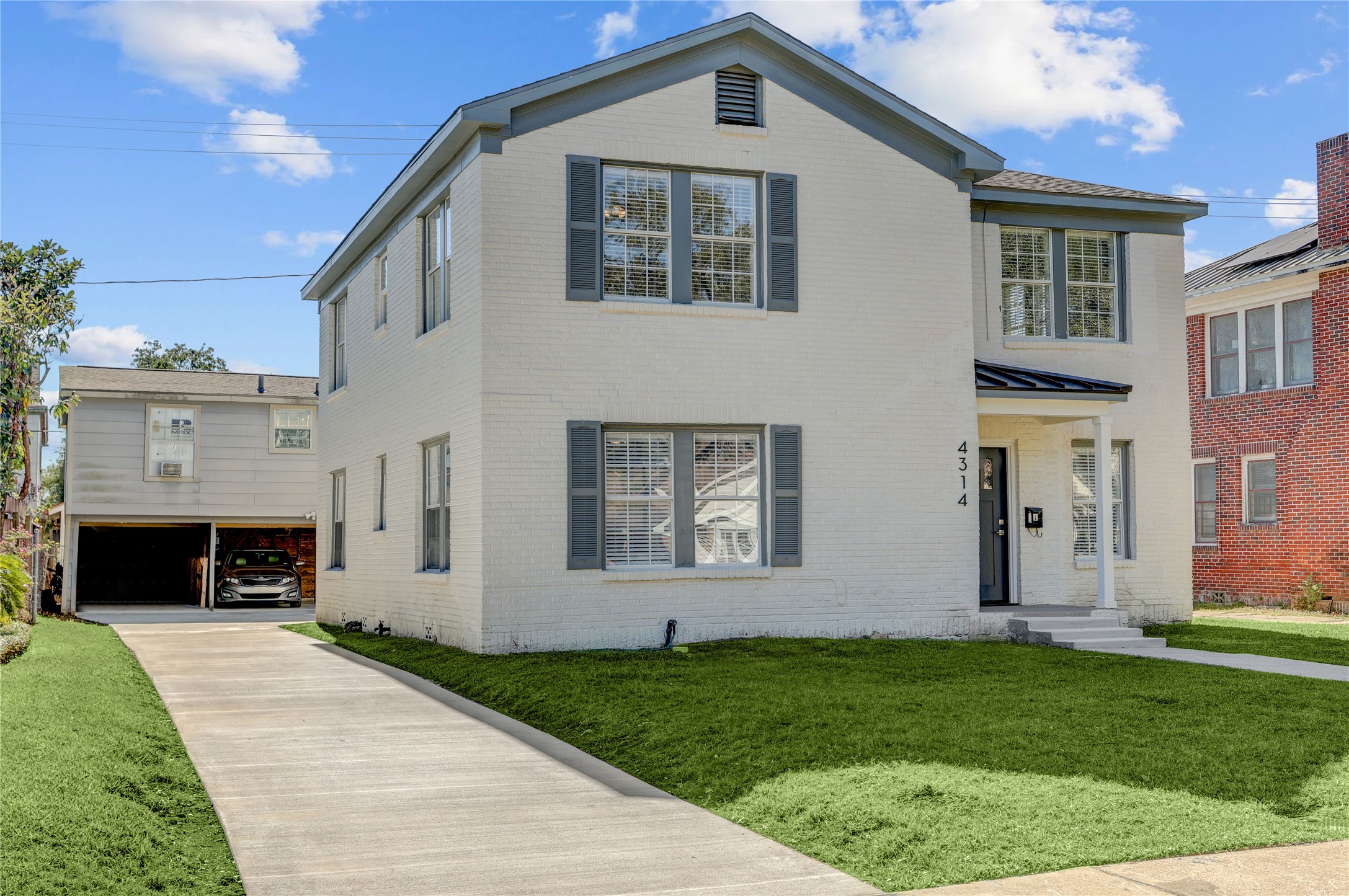 4314 Bell Street, Unit 1 Houston, TX 77023 - Photo 3 of 17 a front view of a house with garden