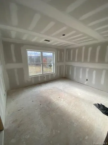 a view of staircase with white walls and windows
