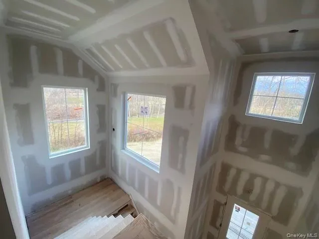 a bed room with a bed and a window