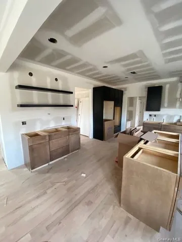 a kitchen with stainless steel appliances granite countertop a sink and cabinets