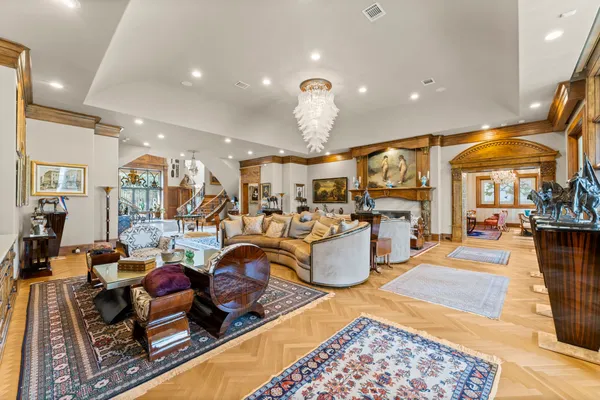a living room with lots of furniture and kitchen view