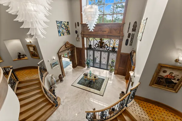 a view of a livingroom with furniture hardwood floor and hallway