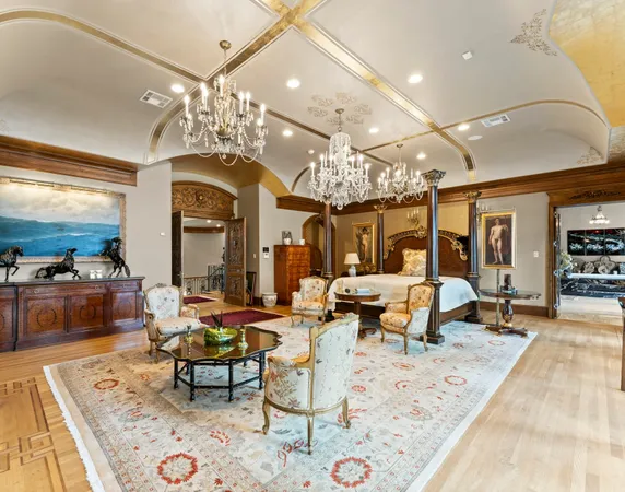 a living room with lots of furniture and view of kitchen