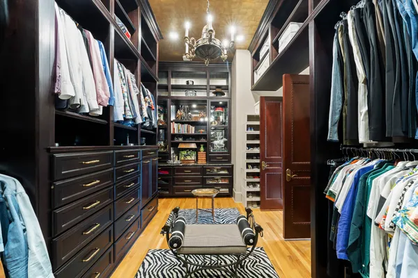 a living room with furniture fireplace and rug