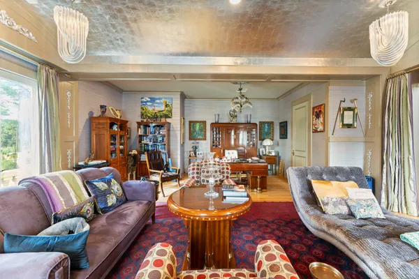 a view of swimming pool with sitting area and garden