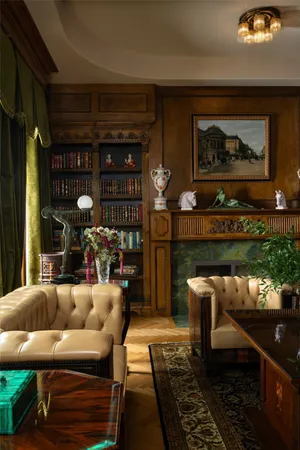 a living room with furniture a rug and a fireplace