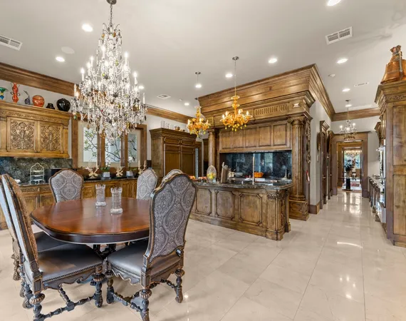 a dining room with furniture and chandelier