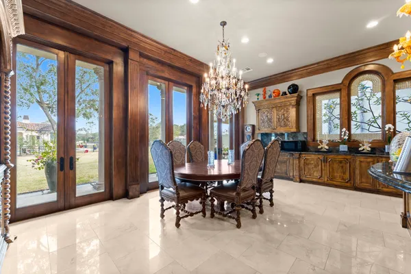 a view of a dining room with furniture window and outside view