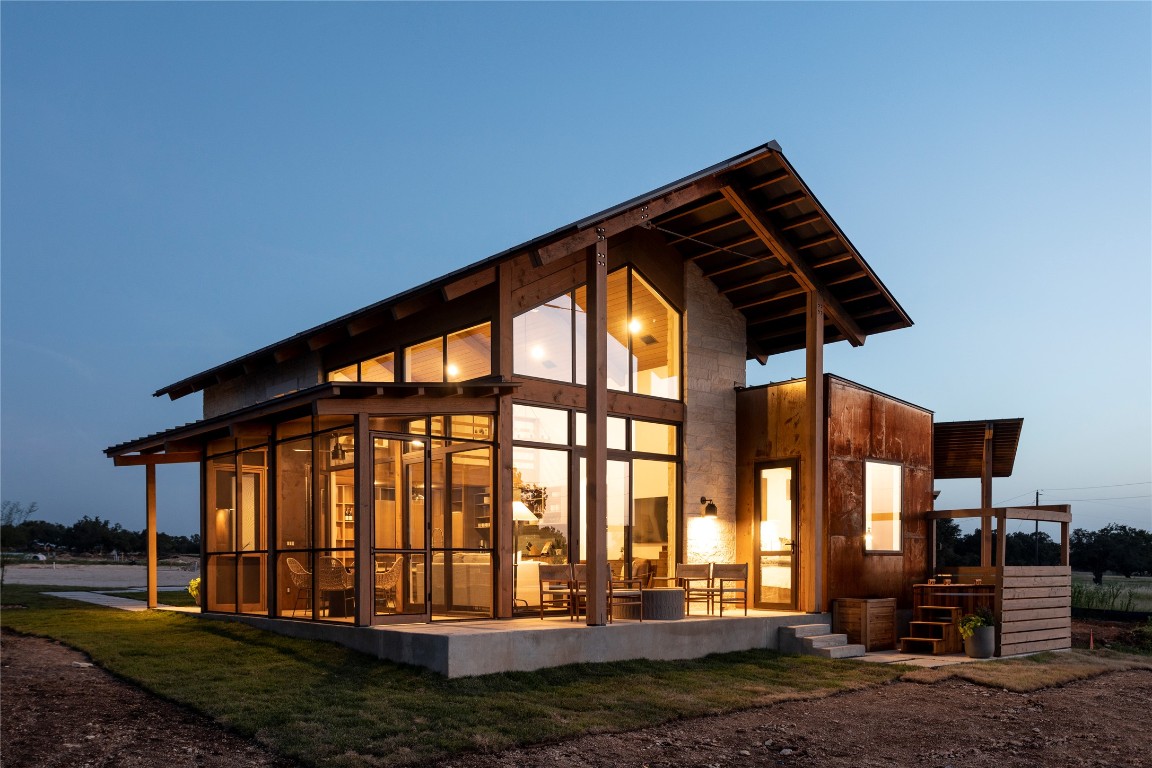 9361 Highway 290, Unit 3 Hye, TX 78635 - Photo 12 of 38 a front view of a house with garden