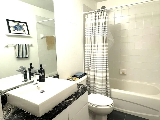 a bathroom with a sink toilet and a bathtub