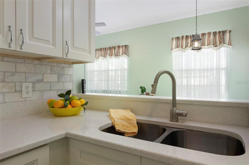 1050 Starkey Road, Unit 208 Largo, FL 33771 - Photo 14 of 30 a kitchen with a sink and a window