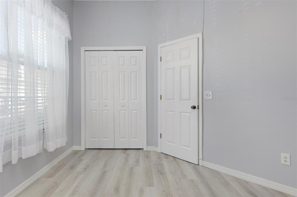 1050 Starkey Road, Unit 208 Largo, FL 33771 - Photo 21 of 30 a view of an empty room with wooden floor