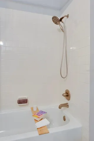 a bathroom with a bath tub