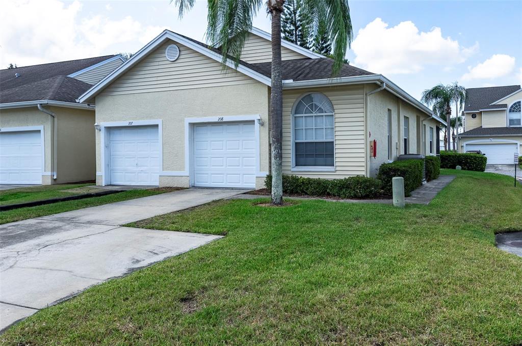 1050 Starkey Road, Unit 208 Largo, FL 33771 - Photo 3 of 30 a front view of house with yard and green space