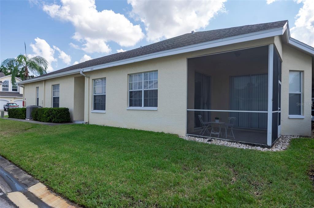 1050 Starkey Road, Unit 208 Largo, FL 33771 - Photo 4 of 30 a front view of a house with garden
