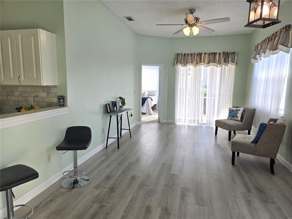 1050 Starkey Road, Unit 208 Largo, FL 33771 - Photo 6 of 30 a living room with furniture and a window