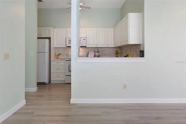an empty room with wooden floor