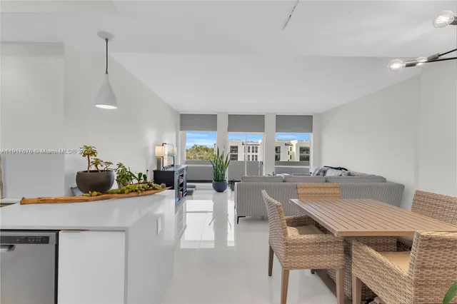 a view of a dining room with furniture and a table