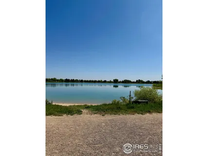 a view of a swimming pool and mountains in the background