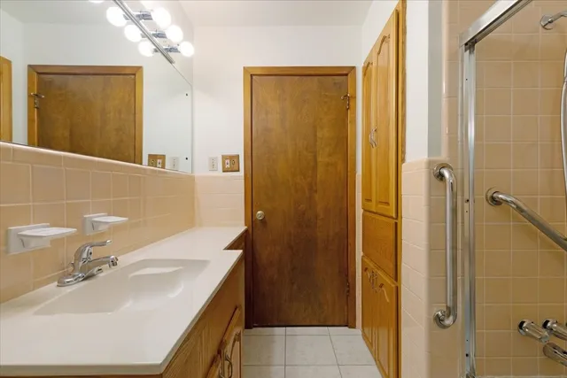 a bathroom with a shower and a shower