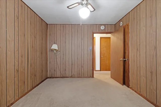 a view of backyard of house with green space
