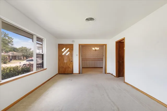 a view of empty room with front door