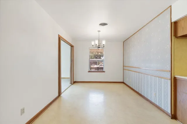 a view of a hallway with windows