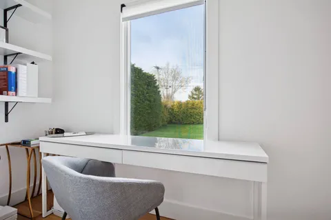 a living room with a couch and a large window