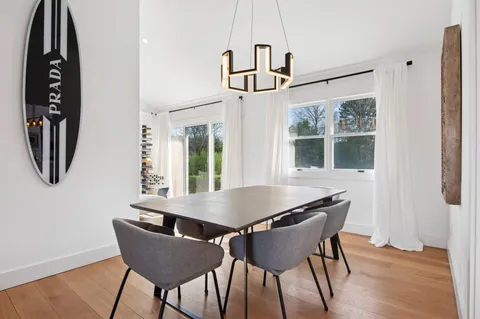 a view of a dining room with furniture and window
