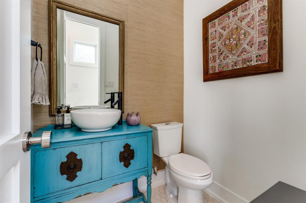 4206 Manning Lane Dallas, TX 75220 - Photo 18 of 35 a bathroom with a toilet mirror and vanity