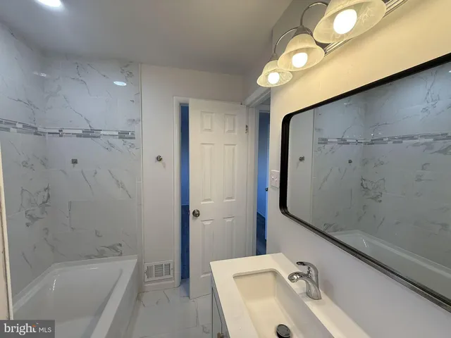 a bathroom with a sink and a tub