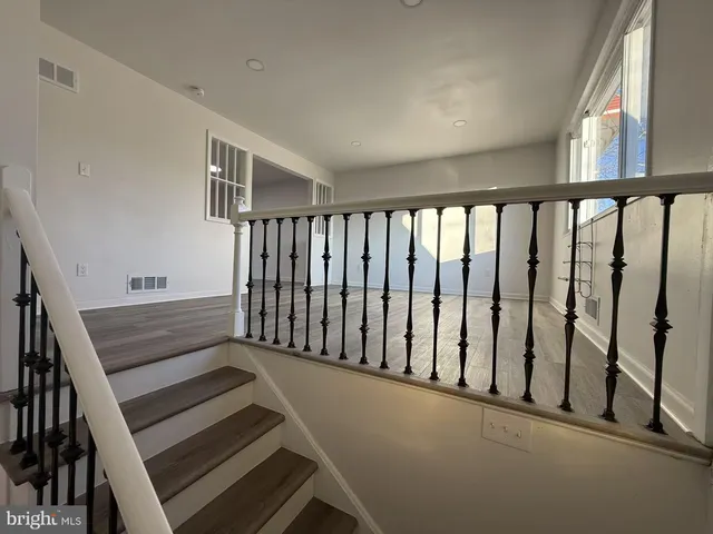 a view of wooden floor with windows
