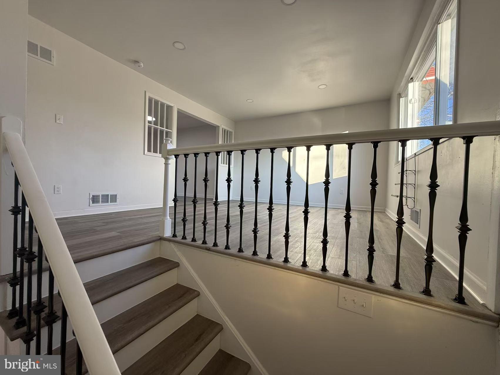 1328 W Street Northeast Washington, DC 20018 - Photo 2 of 25 a view of wooden floor with windows