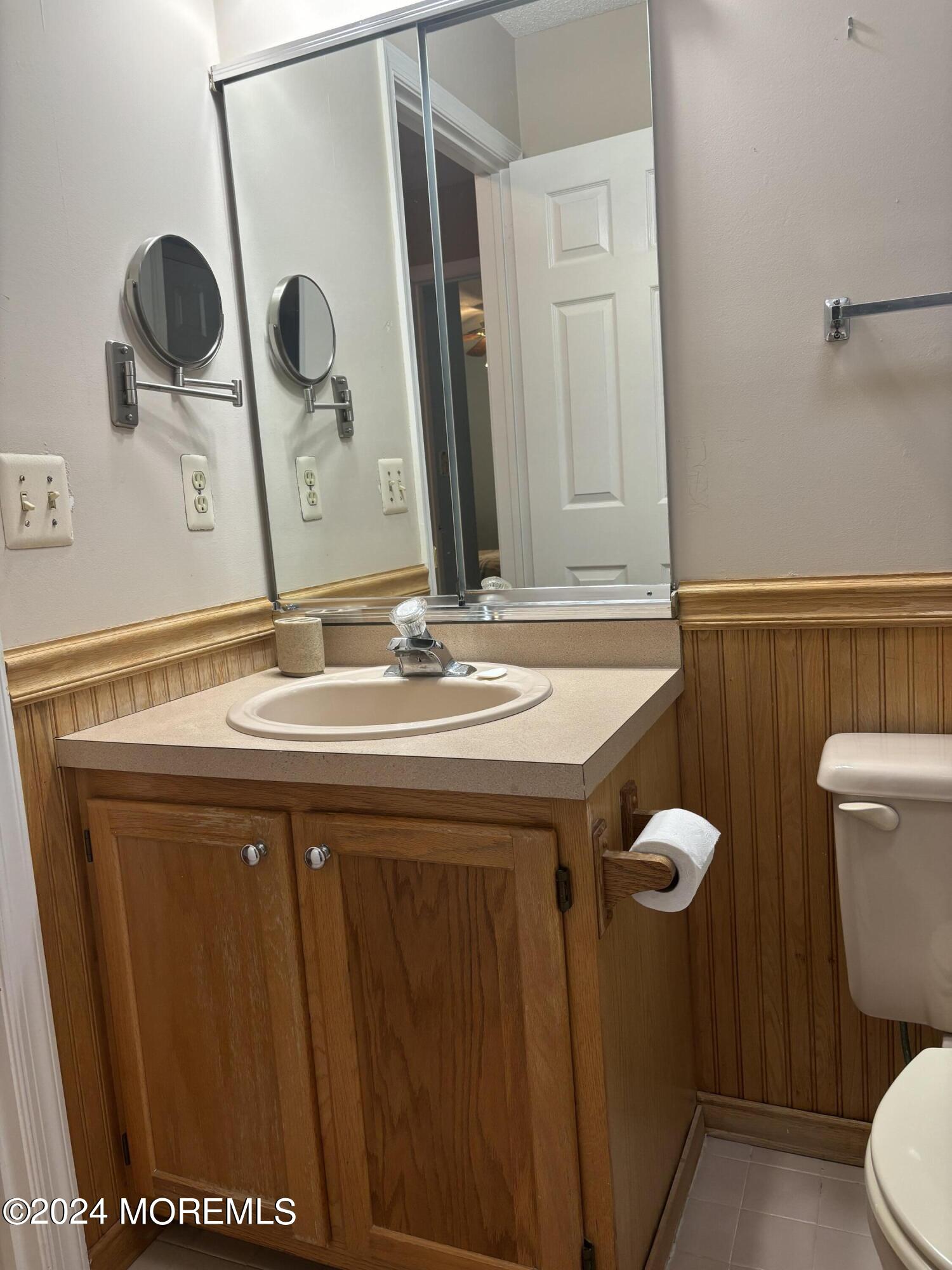 11 Springhill Drive Brick, NJ 08724 - Photo 12 of 15 a bathroom with a sink a toilet and a mirror