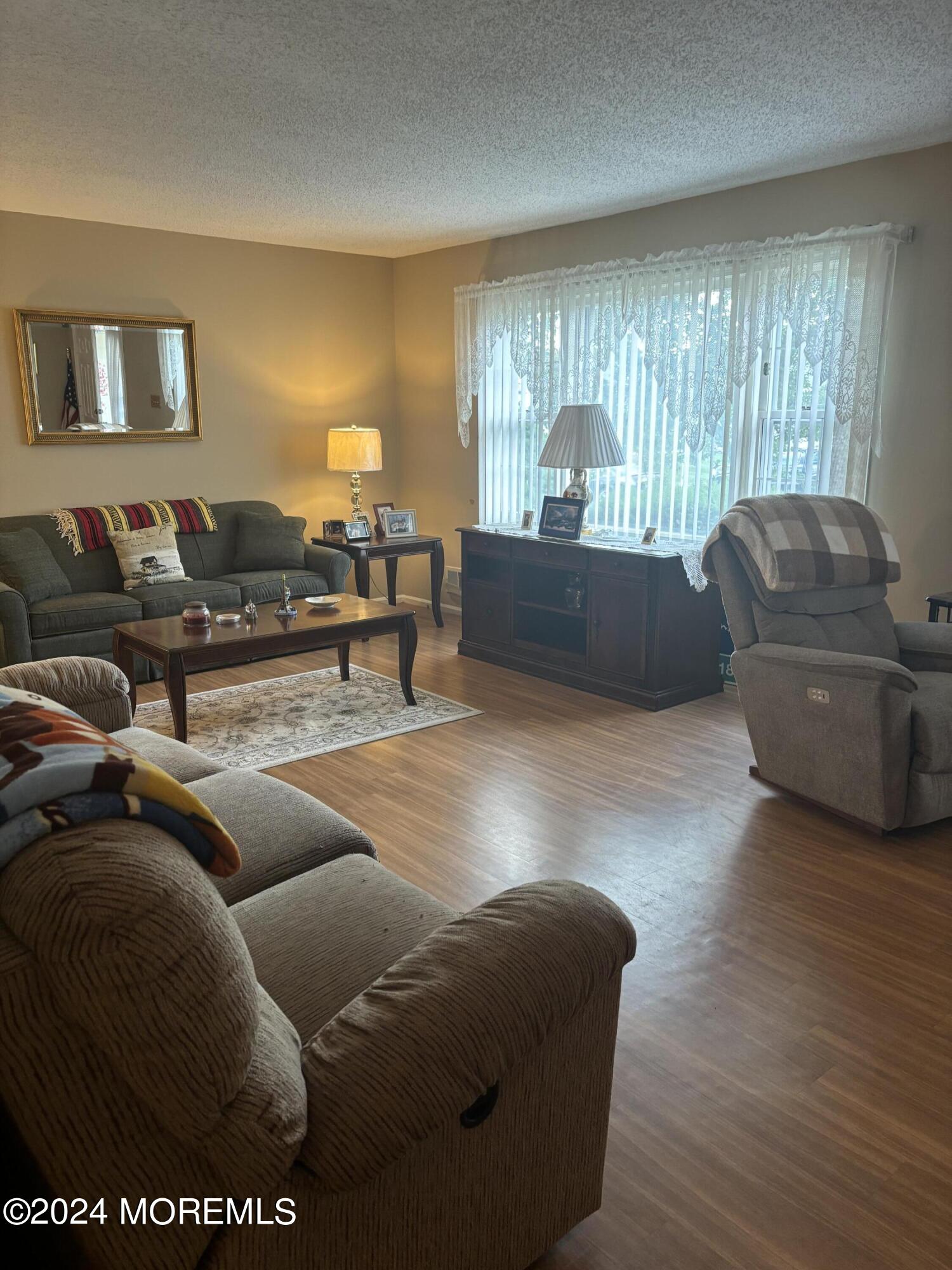 11 Springhill Drive Brick, NJ 08724 - Photo 2 of 15 a living room with furniture and a couch