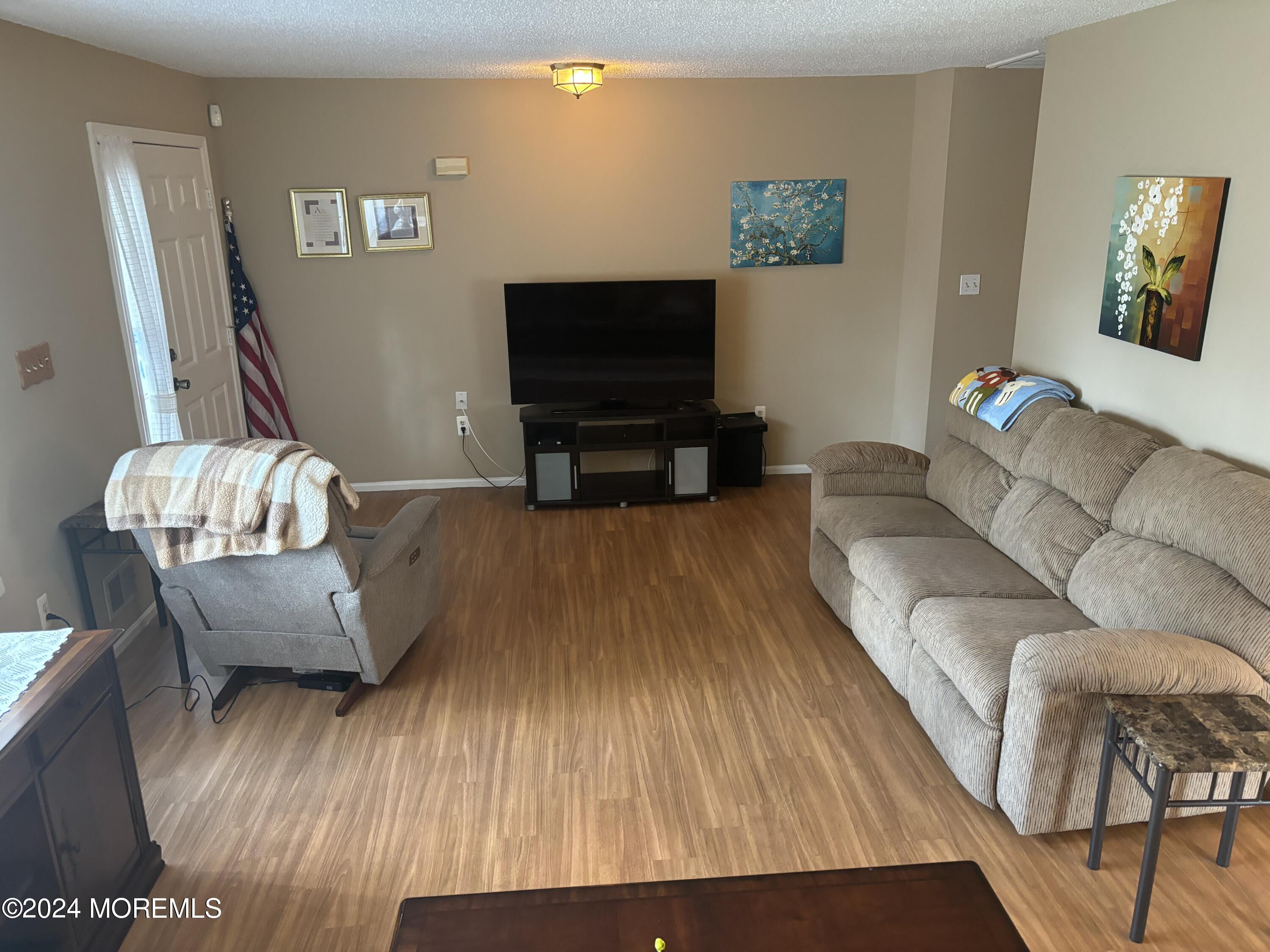 11 Springhill Drive Brick, NJ 08724 - Photo 3 of 15 a living room with furniture and a flat screen tv