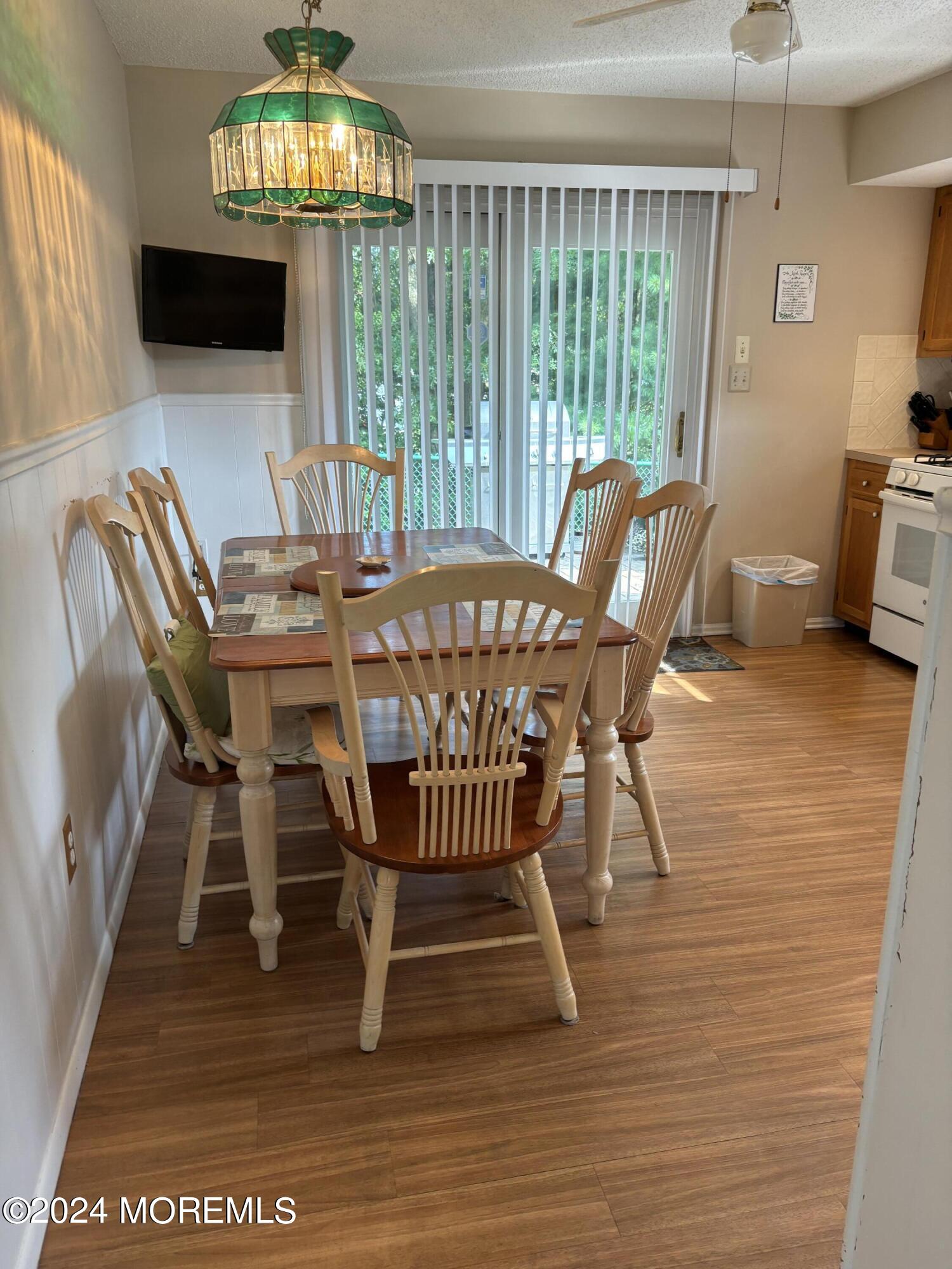 11 Springhill Drive Brick, NJ 08724 - Photo 5 of 15 a view of a dining room with furniture a chandelier and wooden floor