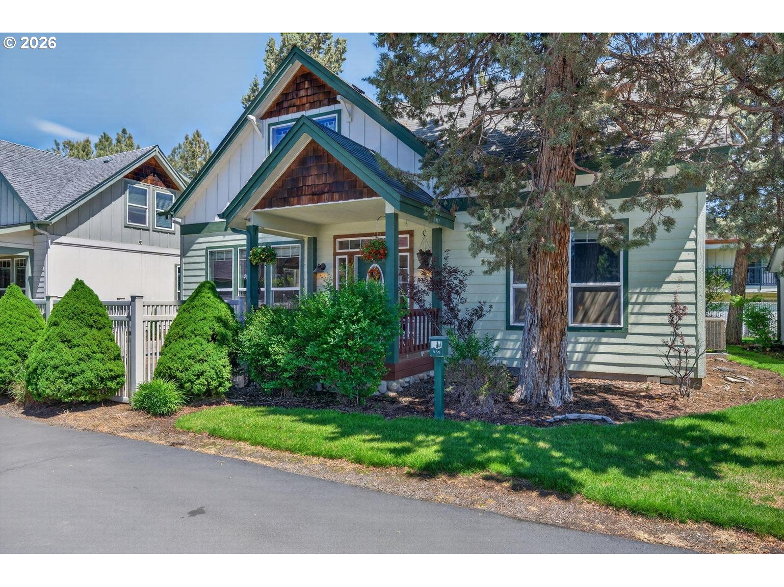 538 North Tam Rim Drive Sisters, OR 97759 - Photo 2 of 45 a front view of a house with a yard and potted plants