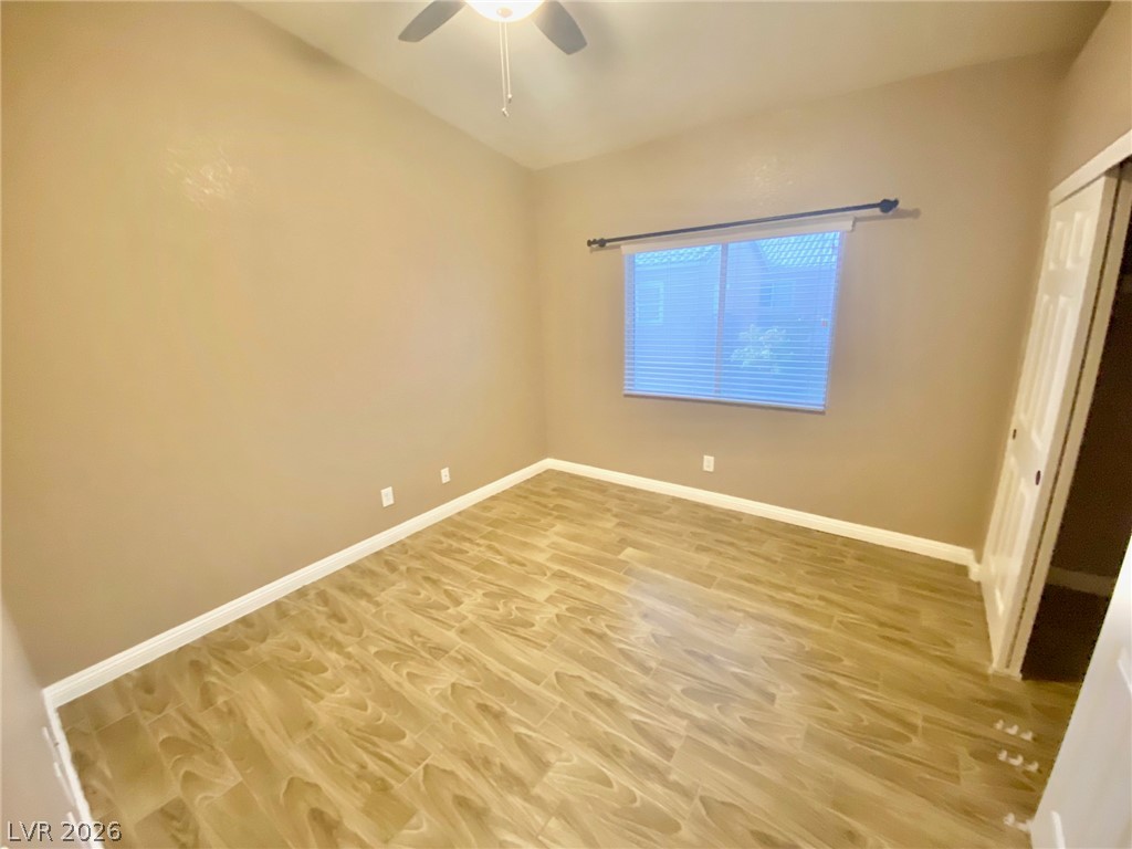 2000 Turquoise Ridge Street, Unit 204 Las Vegas, NV 89117 - Photo 18 of 29 Bright and airy, this bedroom features resilient wood-look flooring and a functional ceiling fan.