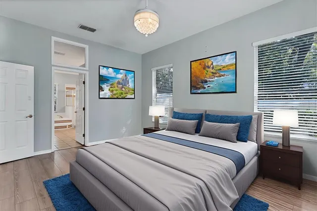 a spacious bathroom with a tub sink and shower