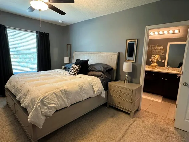 a bed room with bed and window