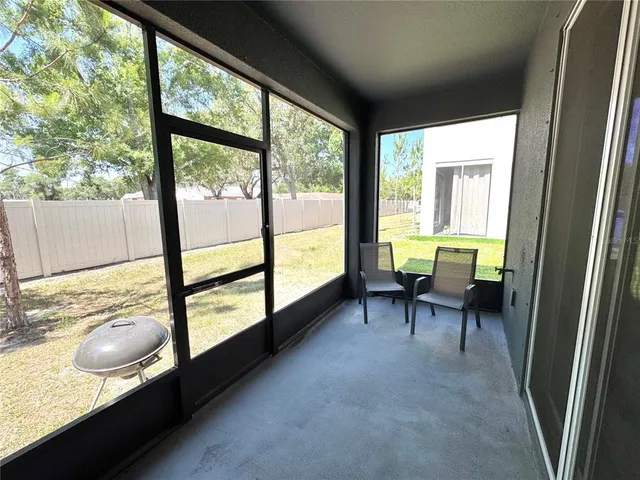 a view of a two chairs in the balcony