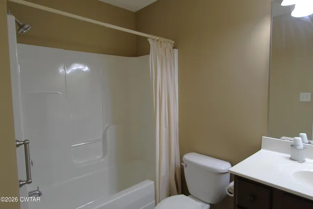 a bathroom with a toilet and sink