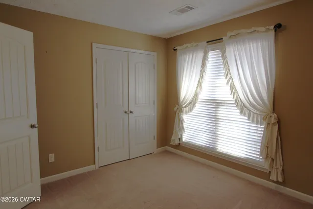 a view of a room that has a window in it