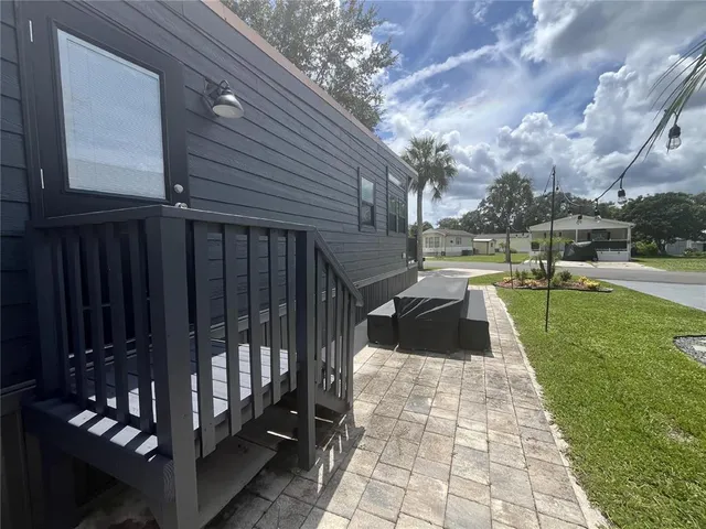 a view of a house with a backyard