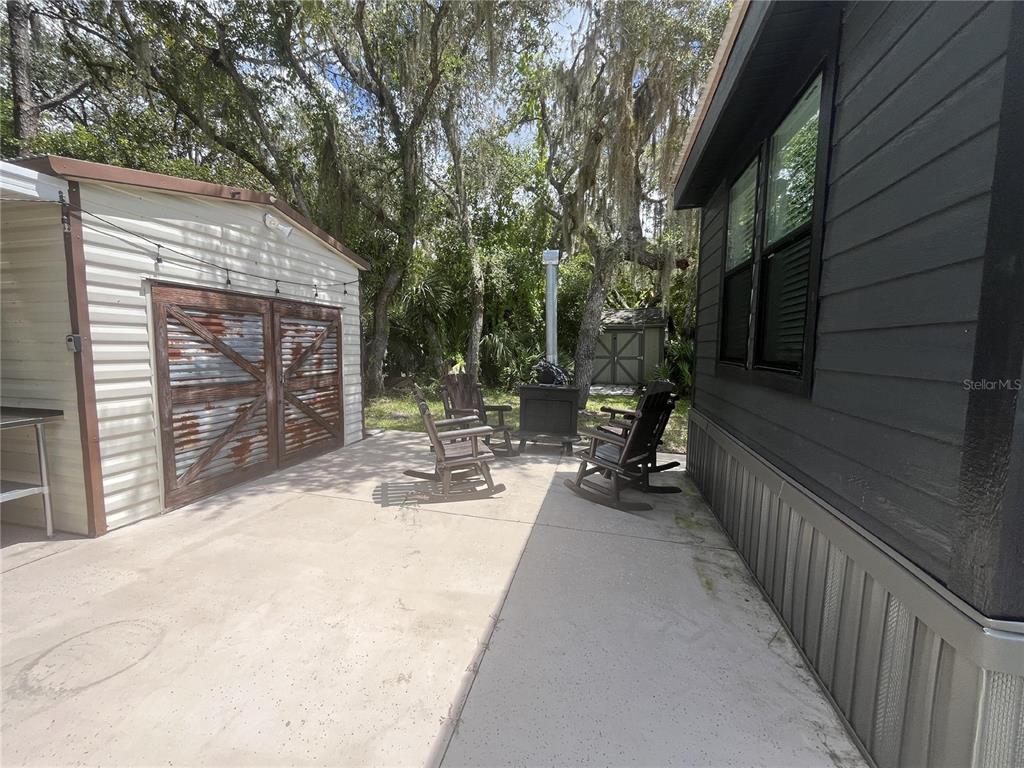 112 East Appaloosa Trail River Ranch, FL 33867 - Photo 6 of 10 a view of a house with backyard and sitting area